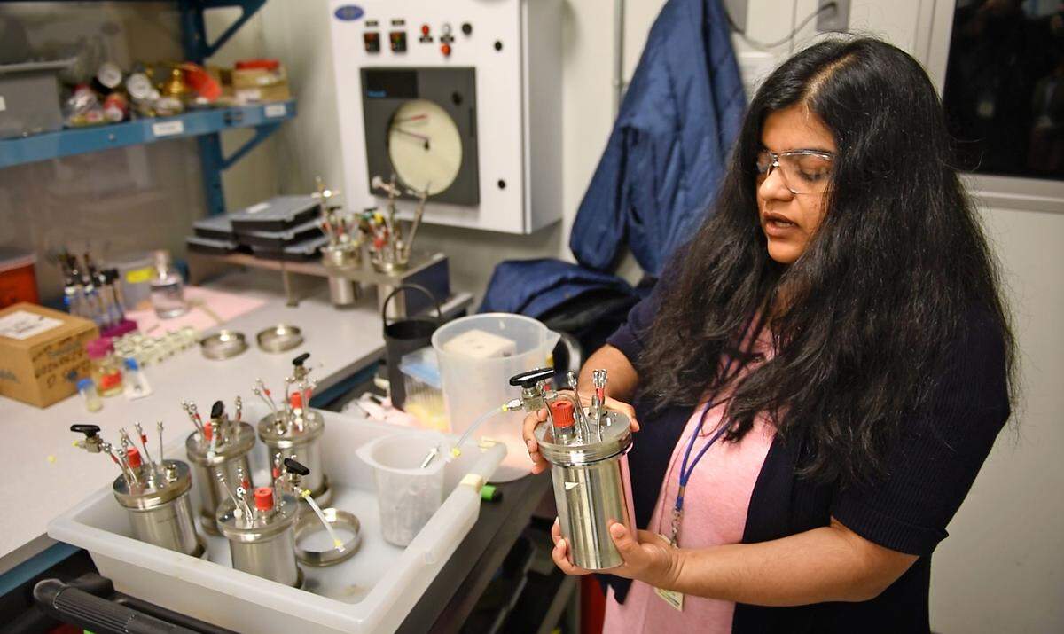 Advanced Biofuels and Bioproducts Process Development Unit (ABPDU) Director Deepti Tanjore shows tanks used in gas fermentation in Emeryville, Calif., Thursday, Feb. 2, 2023.