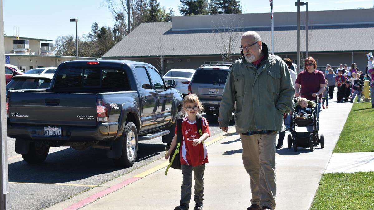 John Queen picks up his daughter, a first-grader, at Weston Elementary in Ripon, CA, on Thursday, March 14, 2019. Ripon Unified School District is working with Sprint to move a cellular phone tower at Weston after four students were diagnosed with cancer and parents voiced their concerns.