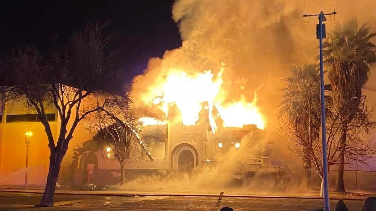 A fire late Thursday, Feb. 24, 2022, burns an unoccupied building in the 300 block of North Center Street in Turlock, Calif.