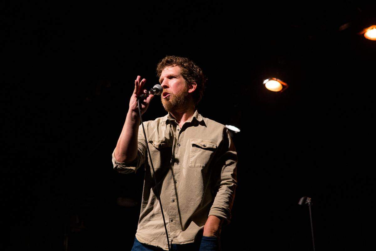 Comedian Kris Tinkle on stage. Photo courtesy of Kris Tinkle.