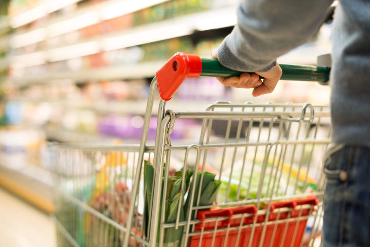 Close-up detail of a man shopping in a supermarket.