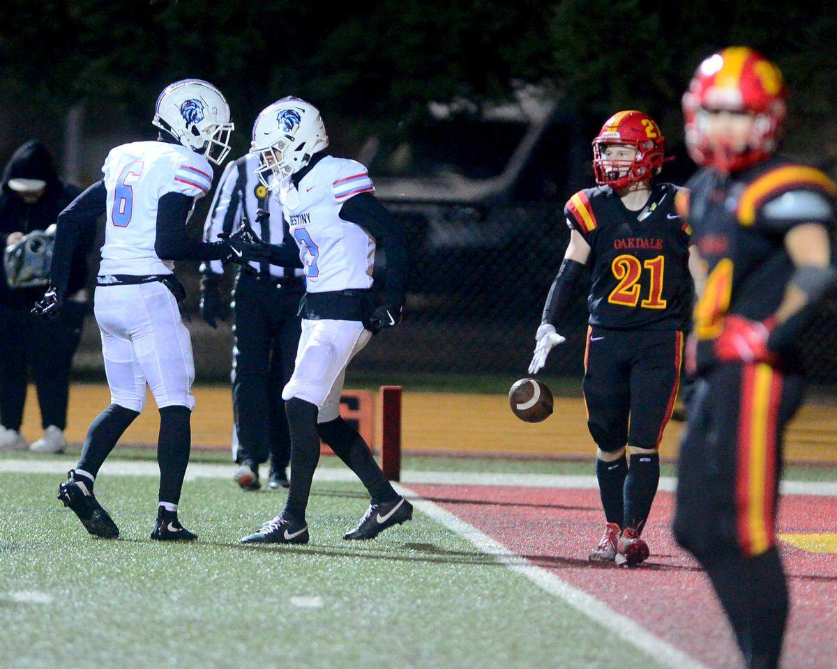 Destiny Christian Academys Greyson Smith (3) celebrates with Antonio Johnson (6) after scoring a touchdown during a 2024 CIF Sac-Joaquin Section Division 3 playoff game between Oakdale High School and Destiny Christian Academy at Oakdale High School in Oakdale California on November 22, 2024. Oakdale won the game 49-35.
