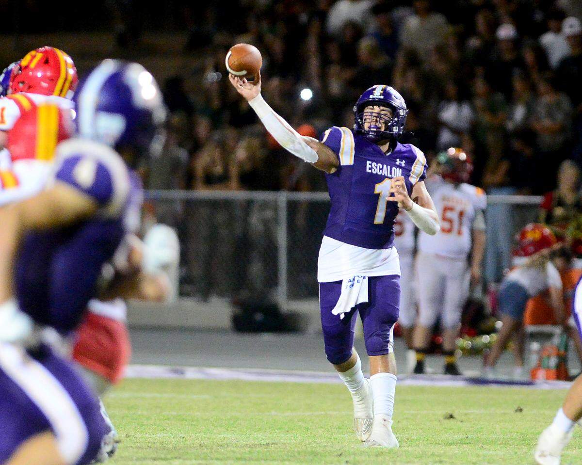 Escalon quarterback Logan Huebner (1) throws a deep pass during a game between Escalon High School and Oakdale High School in Escalon, Calif. on Sept. 6, 2024. Oakdale won the game 21-20 in overtime.
