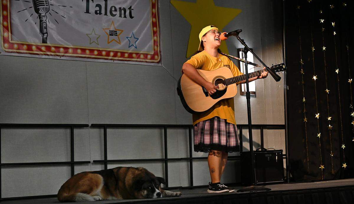 Rebecca Kaplow performs accompanied by her dog Little Girl during the Downtown Streets Team talent show at the Martin G. Petersen Events Center in downtown Modesto, Calif., Friday, May 31, 2024.