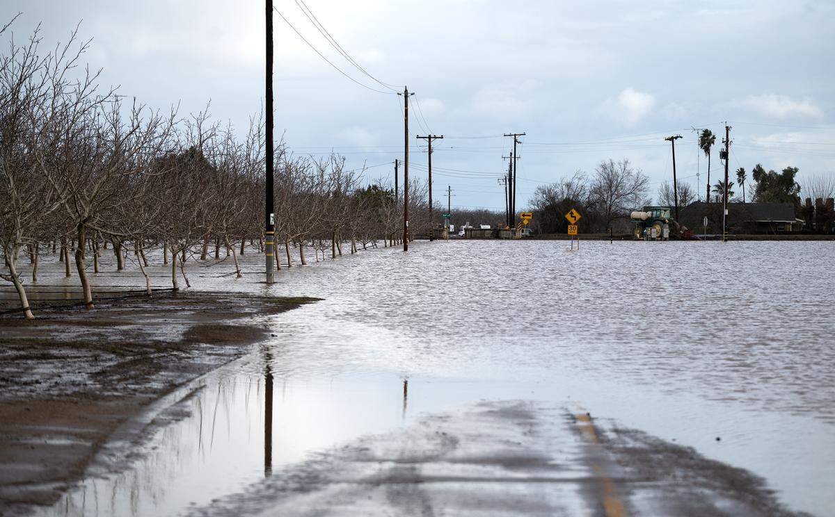 Anderson Road is under water from the Orestimba Creek in Newman, Calif., Tuesday, Jan. 10, 2023.
