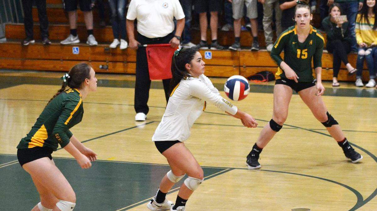 Julia Gonsalves, middle, and Hilmar High beat University Prep of Redding on Saturday, Nov. 10, 2018, to advance to the CIF State Northern California Regionals.