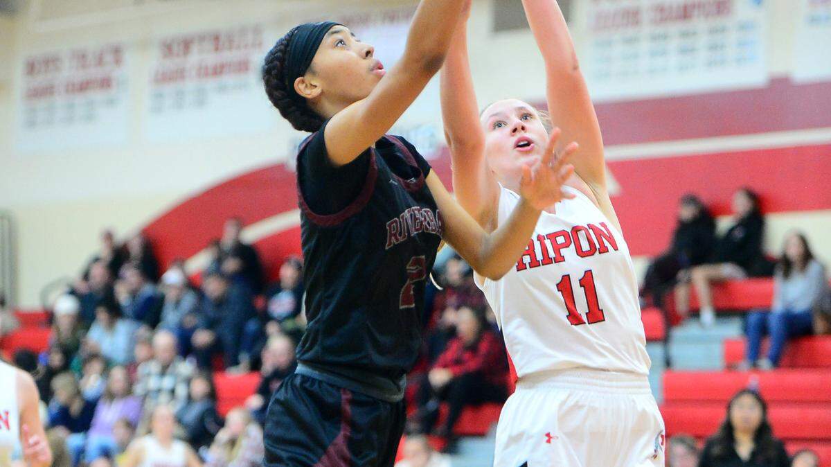 Riverbank guard Taylor Macias (2) lifts the ball for a layup during a game between Ripon High School and Riverbank High School at Ripon High School in Ripon California on Jan. 5, 2023.