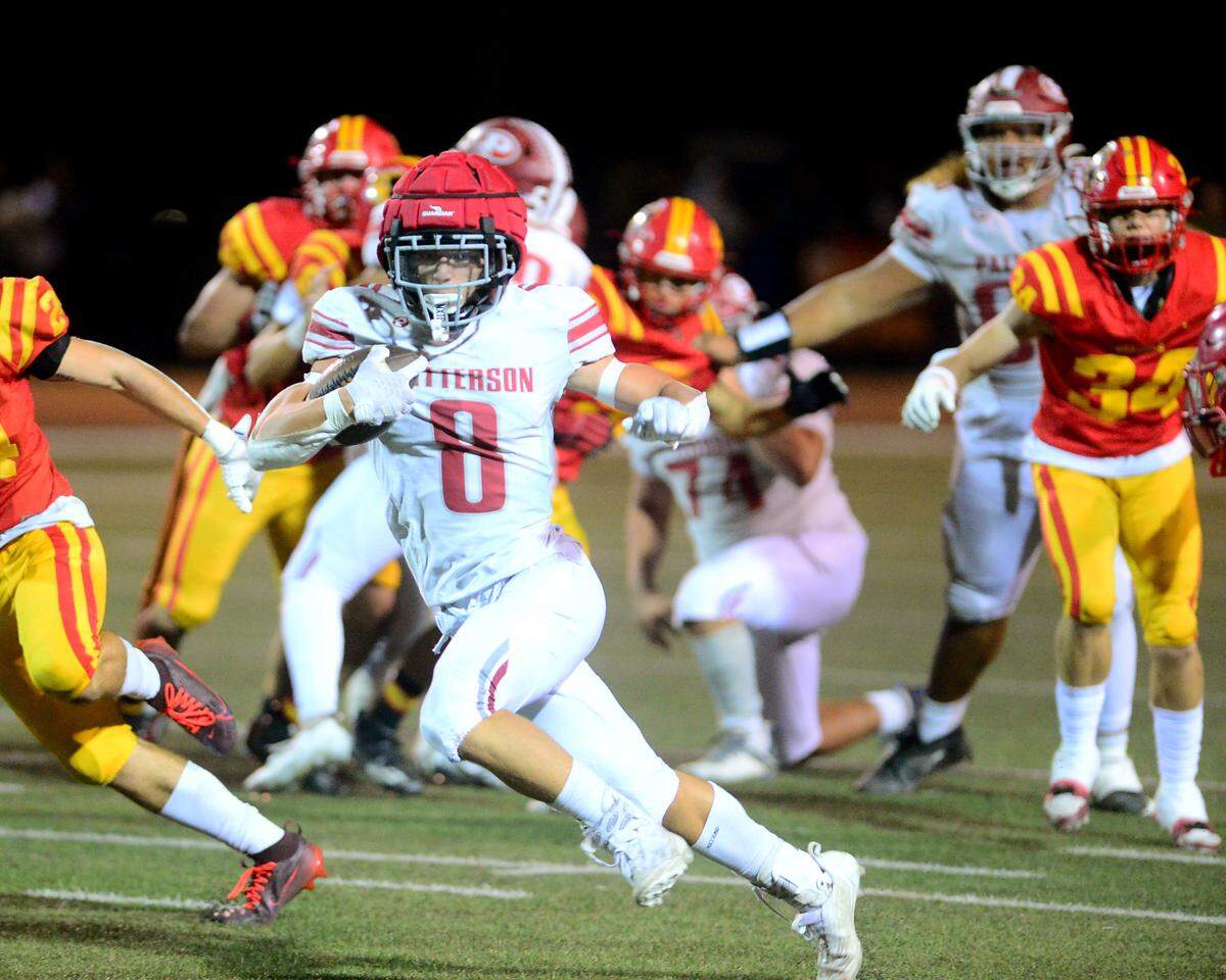 Patterson running back Coby Joseph (8) cuts up field during a game between Oakdale High School and Patterson High School at Oakdale High School in Oakdale California on October 11, 2024. Oakdale won the game 56-40.