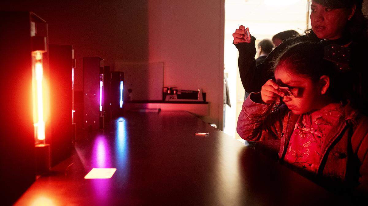 Anais Hernandez, 7, of Turlock looks at the light emission spectrum of various elements during Science Day at California State University, Stanislaus in Turlock, Calif., Saturday March 9, 2019.