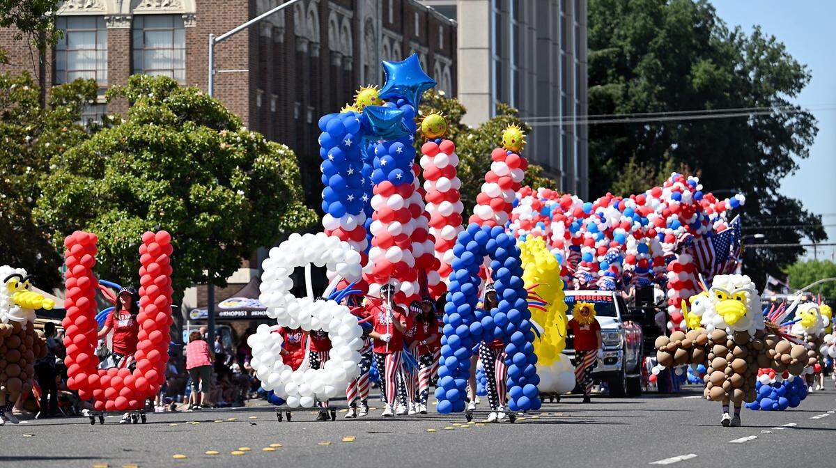 A floats passes through downtown during the 2023 Independence Day Parade in Modesto.