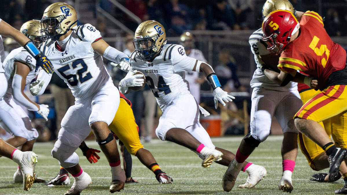 Central Catholic’s Zymir Nelson runs the ball during the Valley Oak League game with Oakdale in Oakdale on  Friday, Oct. 17, 2025.