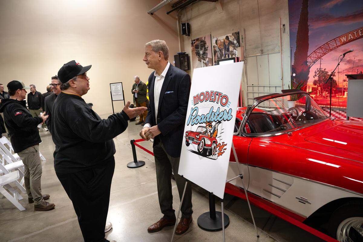 Modesto Roadsters team owner Dave Heller, right, talks with longtime Modesto baseball fan Bill Carlson after a team name reveal at the Graffiti USA Classic Car Museum in Modesto, Monday, Nov. 24, 2025. Heller said the Modesto team will play under the name Glow Riders once a week. 
