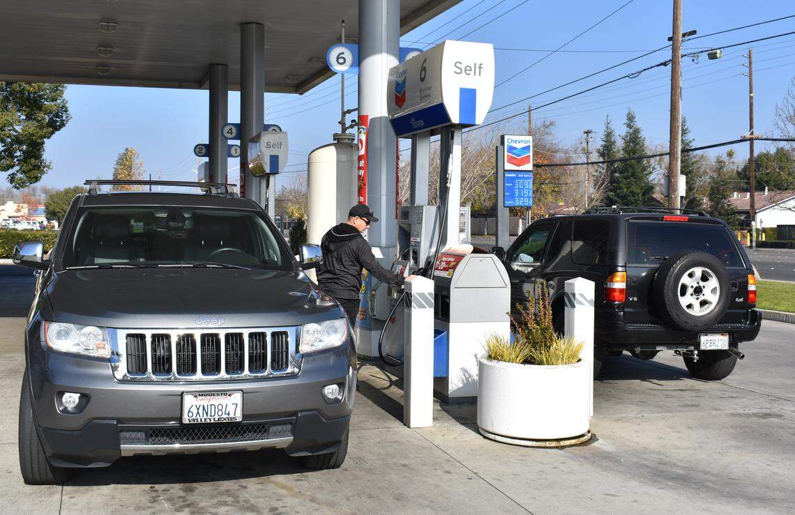 John McDonald gases up at an Oakdale Road Chevron station.