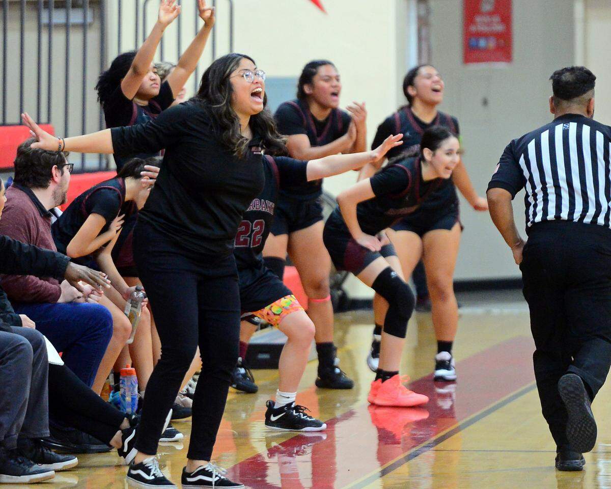 Riverbank Head Coach Janelle Luu celebrates with her team during a game between Ripon High School and Riverbank High School at Ripon High School in Ripon, Calif. on January 5, 2023.