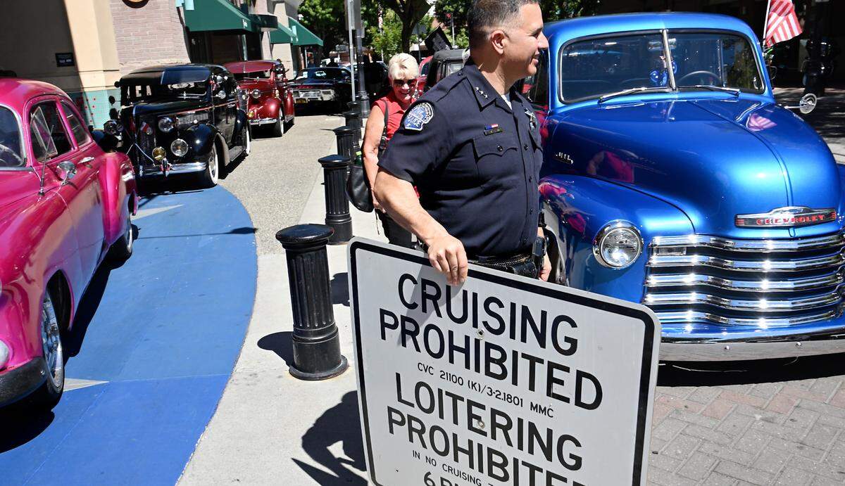 Modesto Police Department, represented by Assistant Chief Ivan Valencia, the Modesto Cruiser Council and Modesto City Staff removed the last “no cruising” sign in downtown Modesto, Calif., Saturday, July 15, 2023. The City Council voted unanimously Tuesday to repeal the 1990 cruising ban, ending it effective immediately.