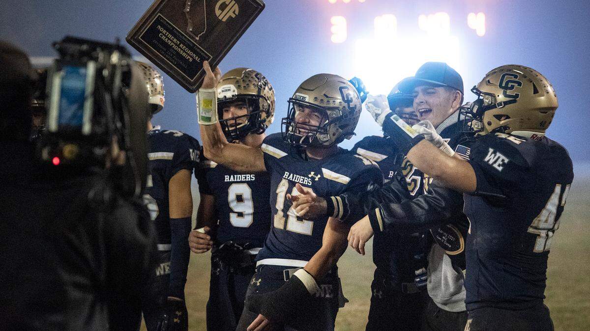 Central Catholic players celebrate their 44-41 victory over Bullard in the CIF Division II Northern California Regional Championship game at Central Catholic High School in Modesto, Calif., Dec. 3, 2021.