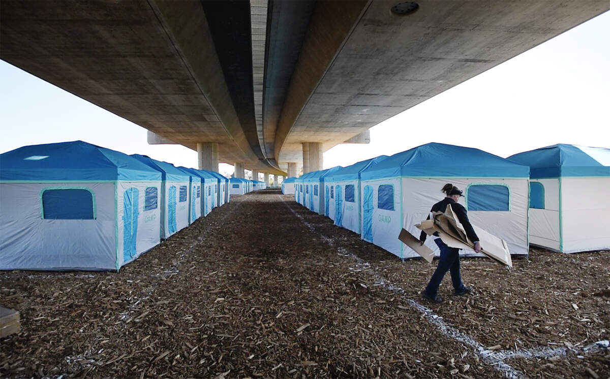 Tents have been assembled in preparation for the new homeless camp under the Ninth Street Bridge at Gateway Park in Modesto, Calif., Tuesday, Feb. 19, 2019.