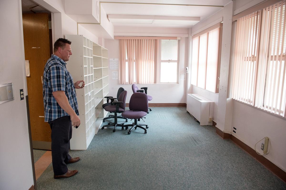 Stanislaus County construction manager Jason Roberts looks at one of the rooms inside the former Scenic General Hospital where the county is proposing creating a low-barrier homeless shelter at its Scenic Drive government center in Modesto, Calif., Thursday, August 9, 2018. 