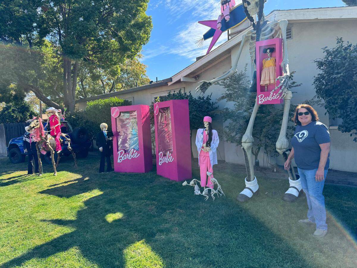 Rita Machado with her Barbie Bones Land Halloween display on the corner of Merritt St. and Minaret Ave. in Turlock on Thursday, October 24.
