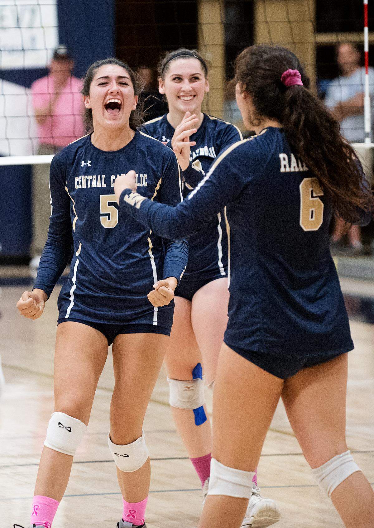Central Catholic’s Lauren Gary celebrates with teammates after winning a point during the Valley Oak League match with Manteca at Central Catholic High School in Modesto, Calif., on Thursday, Oct. 4, 2018.
