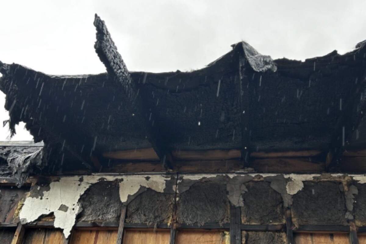 Charred roofing and structural damage are visible at an abandoned Patterson car wash following a 2025 fire that prosecutors said could have spread to nearby homes and businesses.