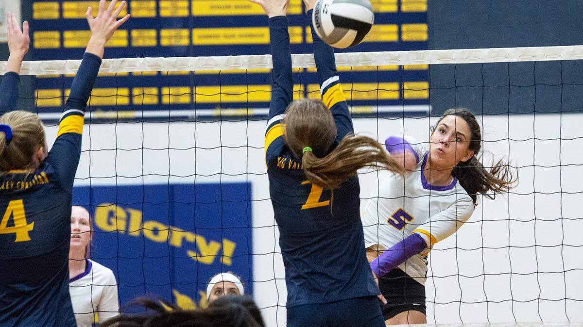 Escalon’s Emily Vickers spikes the ball past Big Valley Christian’s Jordan Beers during the match at Big Valley Christian High School in Modesto, Calif., on Monday, Oct. 4, 2021.