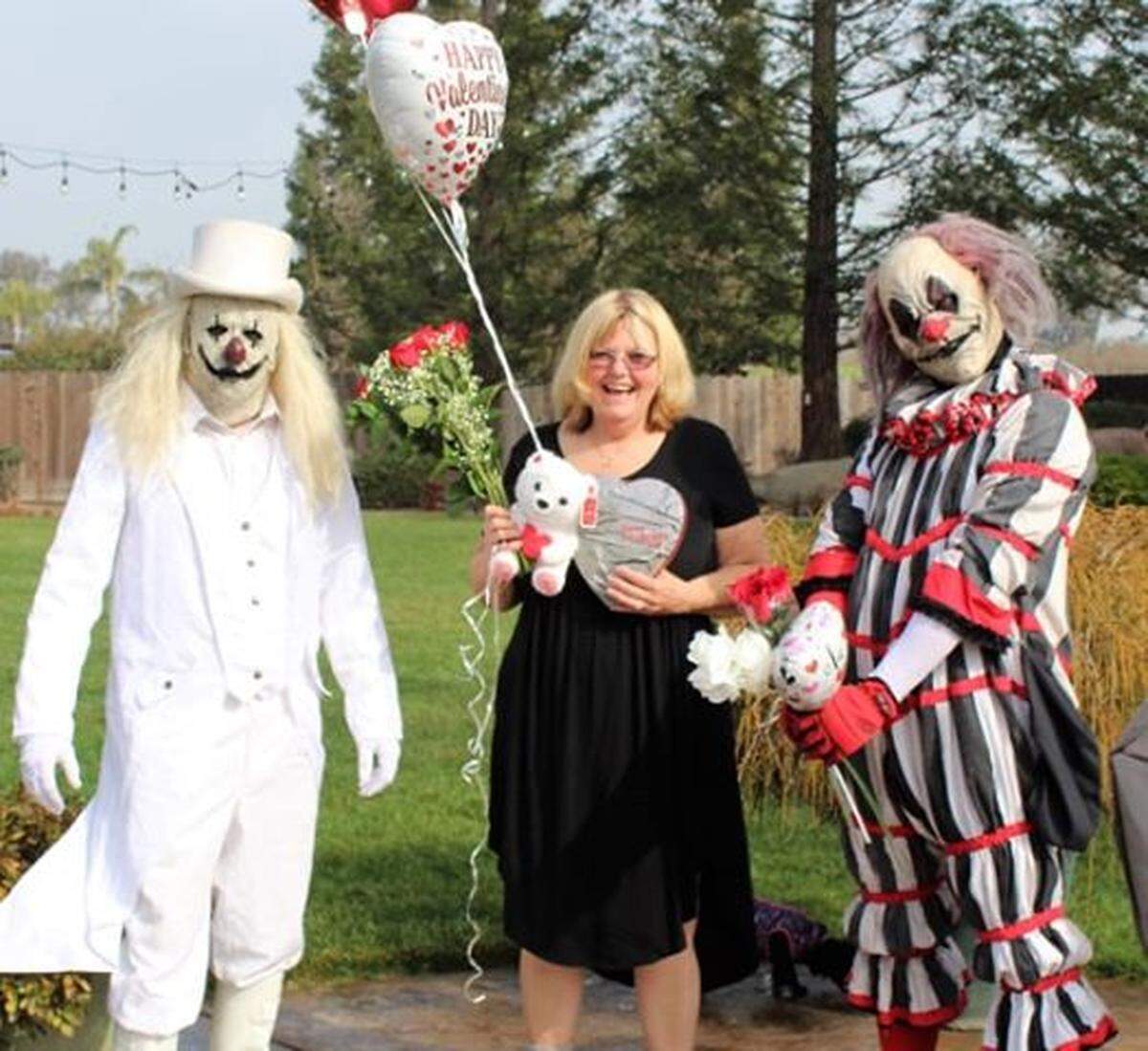 Turlock-based Ranch of Horror is offering valentine grams delivered by any combination of its spooky clowns. Here, Blanco and Peddles flank Atwater resident Jeanie Knight, who already has received her delivery.