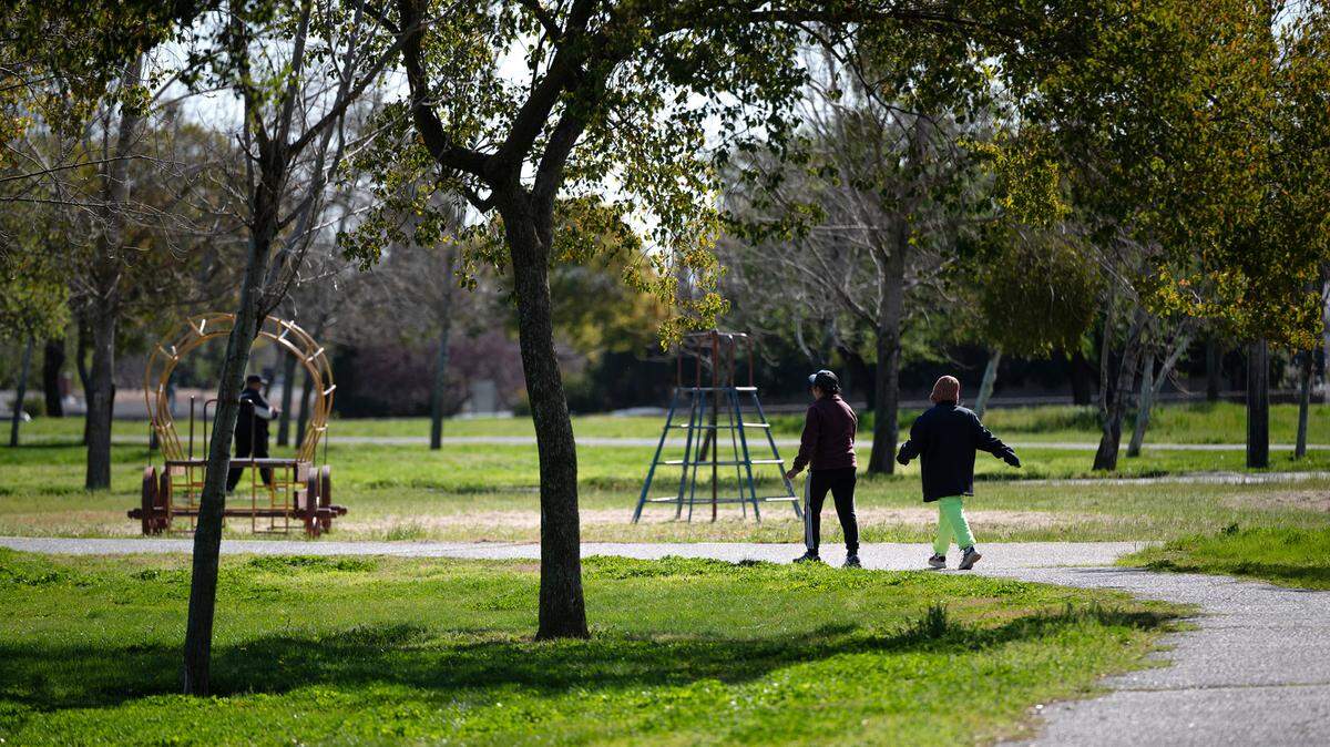 The paved path at Mancini Park is popular with walkers. Photographed in Modesto, Calif., Thursday, March 16, 2023.