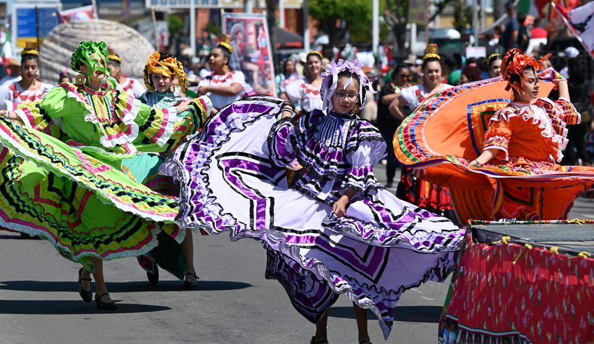 Members of Ballet Folklorico Los Falcones perform in the Cinco de Mayo parade on Crows Landing Road in Modesto, Saturday, May 7, 2022.