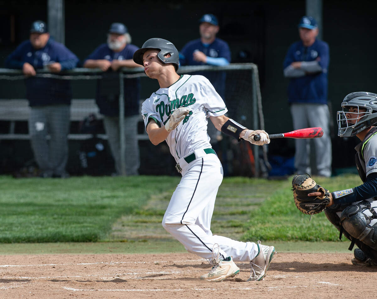 Pitman’s Aidan Garcia drives in a run with a double during the Central California Athletic League game with Downey at Pitman High School in Turlock, Calif., Tuesday, May 2, 2023. Pitman won the game 7-2.