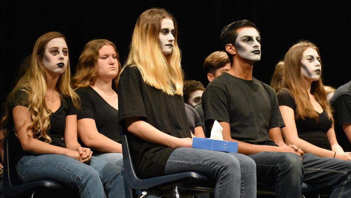 Students portraying the living dead — lives lost to drunk drivers — sit on stage during the Every 15 Minutes DUI awareness and prevention assembly in the Downey High School auditorium on Wednesday, April 3, 2019.