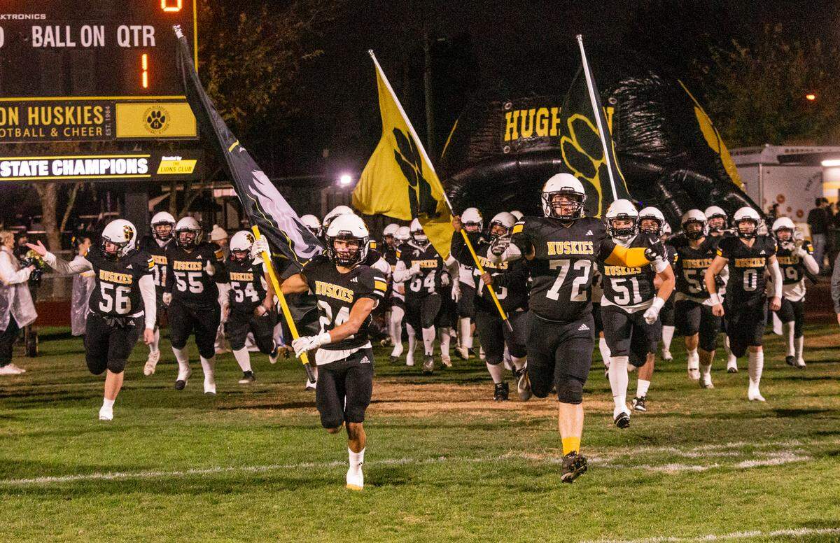 Hughson High takes the field to start the Sac-Joaquin Section Division V Semifinals against Union Mine on at Hughson High School on Friday, Nov. 22, 2024.