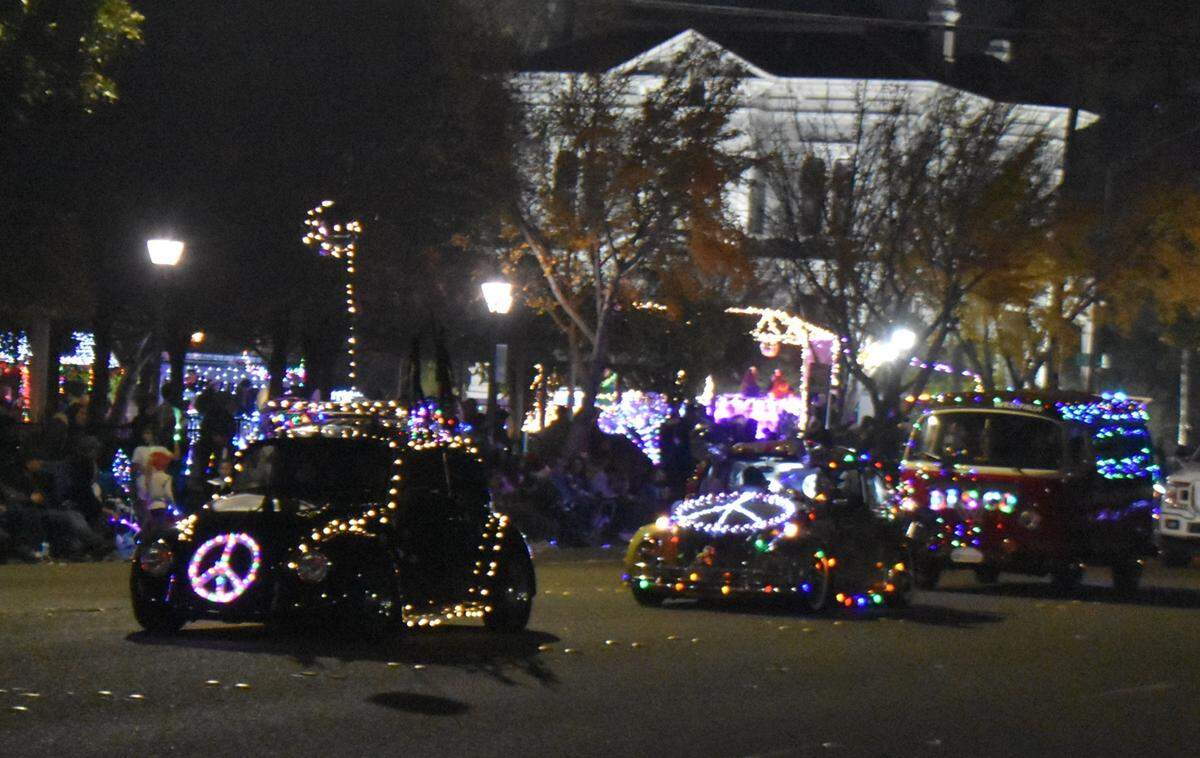 Peace signs and VW Bugs go together like hot cocoa and mini marshmallows. The Celebration of Lights Holiday Parade was held in downtown Modesto on Saturday night, Dec. 7, 2024.