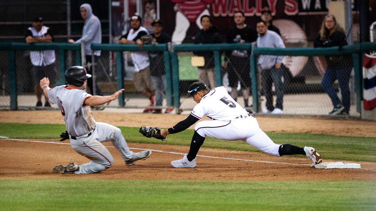 Nuts first baseman Milkar Perez forces out Giants’ Tanner O’Tremba during the Modesto Nuts’ opeing day game with San Jose at John Thurman Field in Modesto, Calif., Tuesday, April 11, 2023.