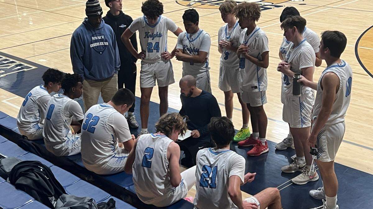Downey coach Mitch Evans draws up a play in the Knights’ opening game at the 2023 Mark Gallo Invitational at Central Catholic High School. Downey beat Liberty Ranch, 42-36.
