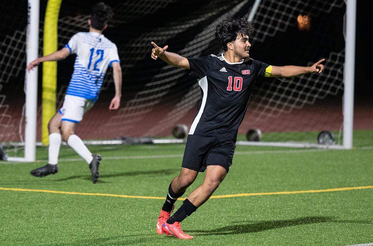 Modesto’s Alexis Luna celebrates after scoring a goal in the Sac-Joaquin section playoff game with Folsom at Downey High School in Modesto, Calif., on Thursday, Feb. 10, 2022. Luna scored all three goals in Modesto’s 3-0 victory.