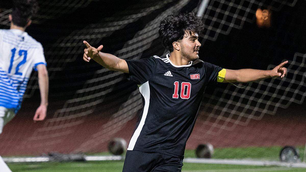 Modesto’s Alexis Luna celebrates after scoring a goal in the Sac-Joaquin section playoff game with Folsom at Downey High School in Modesto, Calif., on Thursday, Feb. 10, 2022. Luna scored all three goals in Modesto’s 3-0 victory.