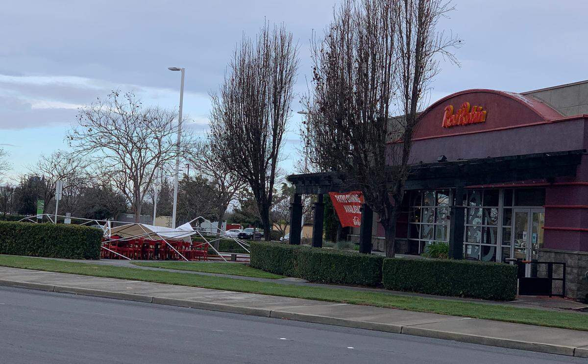 Storm damage in Turlock early Wednesday, Jan. 27, 2021, included the tearing apart of the outdoor dining tent at Red Robin.