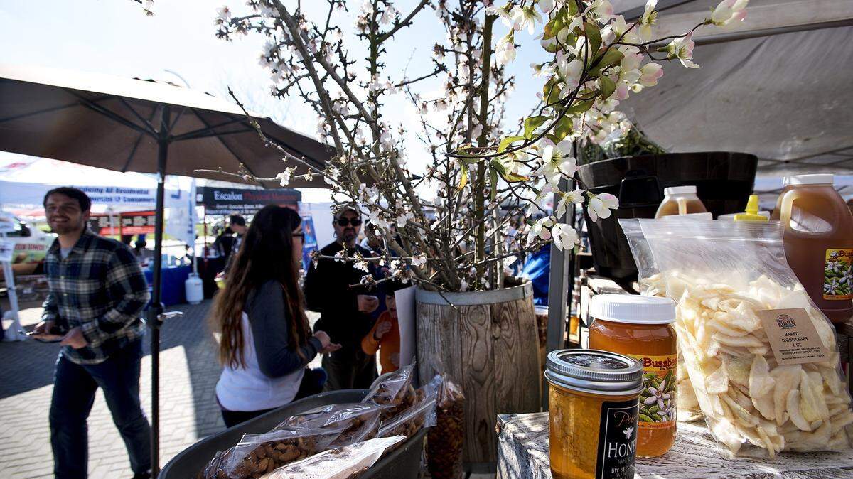 Vendors like Rodin Farms sell their products at the Almond Blossom Festival in Ripon, Calif., on Saturday, Feb. 25, 2017.
