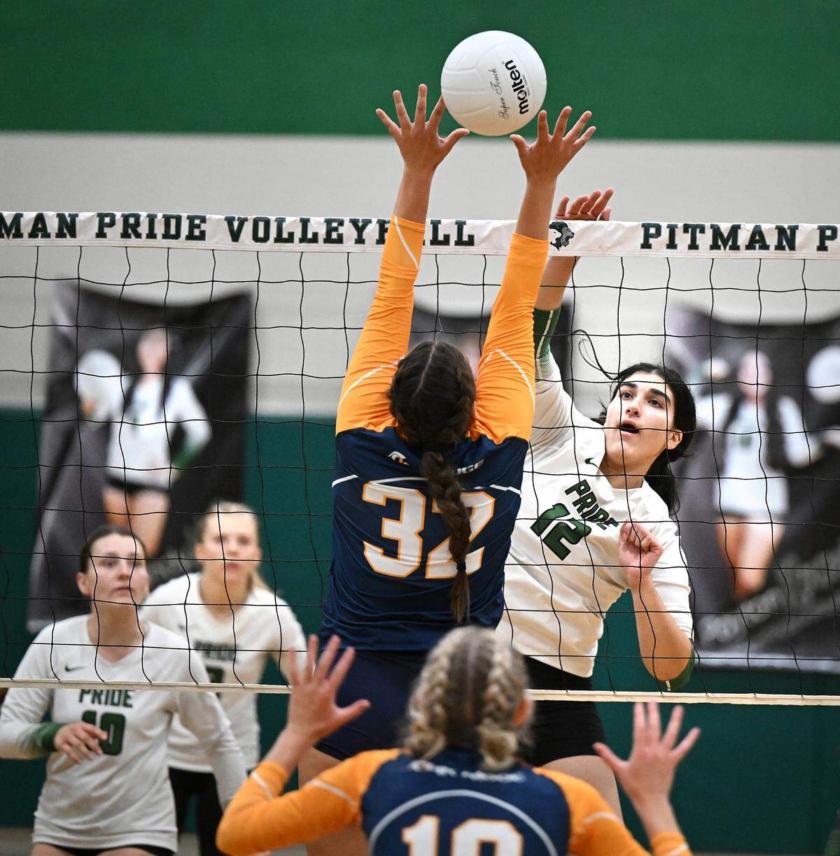 Pitman’s Madison Eissayou floats the ball over Oak Ridge defender Lizi Horning during the non-league match at Pitman High School in Turlock, Calif., Thursday, September 7, 2023.