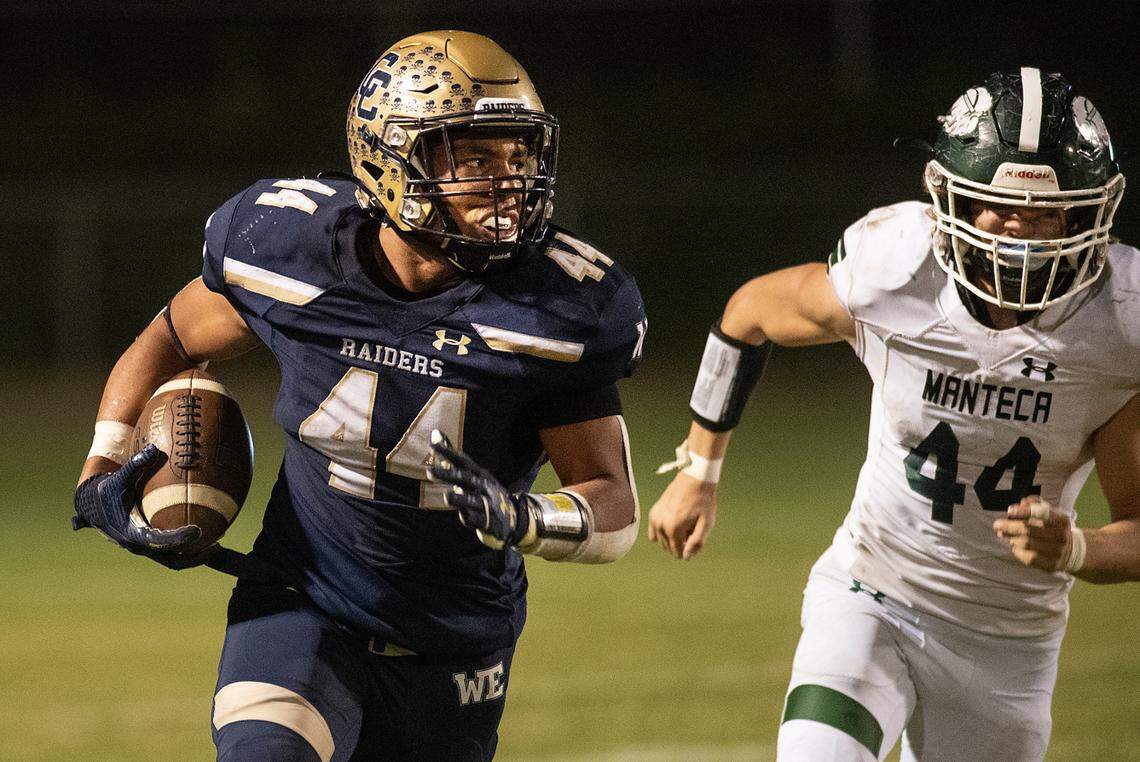 Central Catholic’s Aiden Taylor runs the ball during the Valley Oak League game with Manteca at Central Catholic High School in Modesto, Calif., on Friday, Oct. 15, 2021. Central Catholic won the game 56-33.