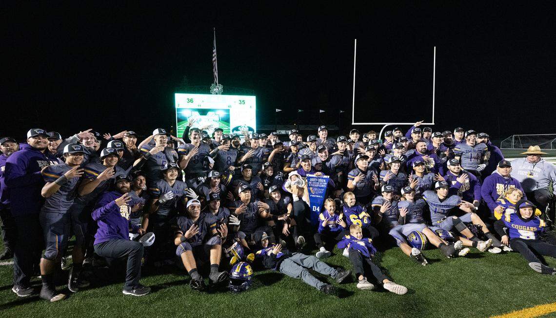 Escalon players pose for pictures after the 36-35 victory over Patterson in the Sac-Joaquin Section Division IV championship game at St. Mary’s High School in Stockton, Calif., Friday, Nov. 24, 2023.
