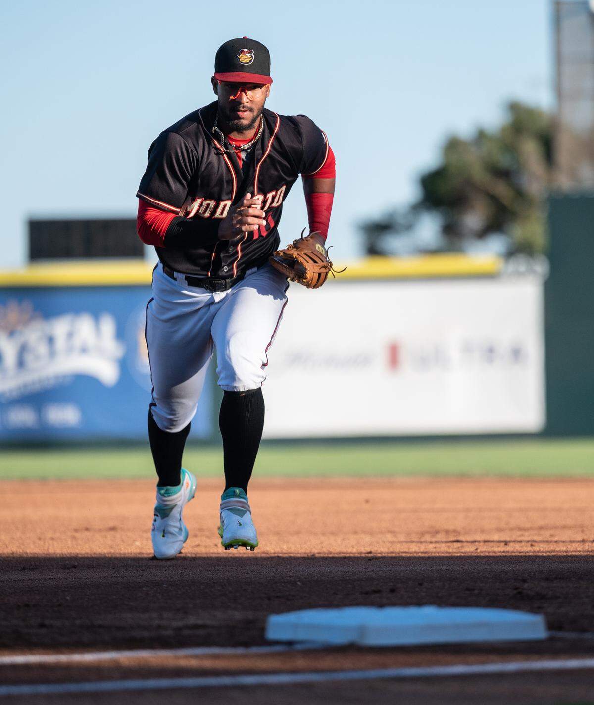 Modesto Nuts firstbaseman Robert Perez Jr. runs to first to force out a runner during the California League game with the Stockton Ports at John Thurman Field in Modesto, Calif., on Wednesday, July 6, 2022.