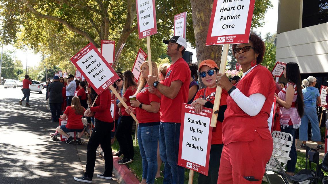 Nurses participate on Friday afternoon September 20, 2019 in a one day strike outside Doctors Medical Center in Modesto, Calif. Nurses represented by the California Nurses Association have been in contract negotiations with Tenet for a year.
