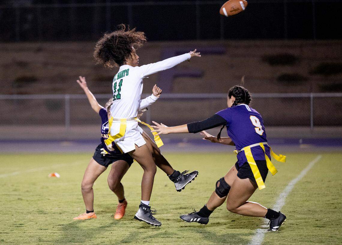 St. Mary’s quarterback Victory Bragg releases the ball under pressure from Escalon’s Alyssa Ball (9) and Hannah Wampler duirng the CIF Sac-Joaquin Section Division II semifinal playoff game in Escalon, Calif., Wednesday, Nov. 1, 2023. St. Mary’s won the game 12-6.