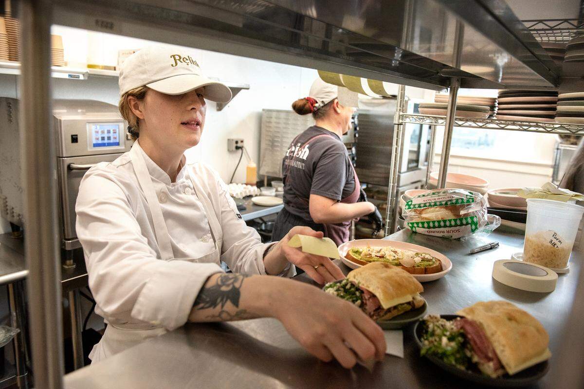 Chef Stephanie Nagle puts out lunch plates at Relish on Main Street in Escalon, Calif., Tuesday, March 21, 2023.