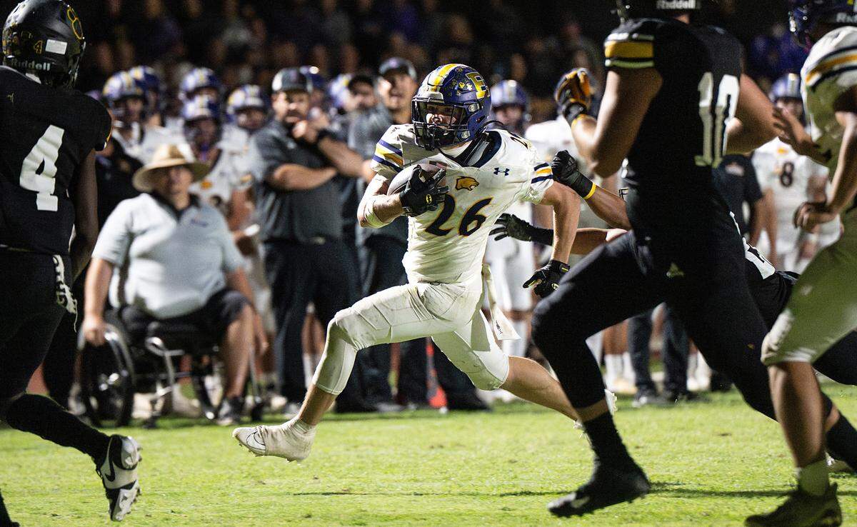 Escalon’s Jamin Miller runs the ball during the Trans Valley League game with Hughson at Hughson High School in Hughson, Calif., Friday, Sept. 29, 2023.