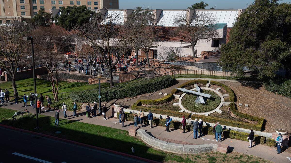 Stanislaus county residents wait in line for a COVID-19 vaccination at Modesto Centre Plaza in Modesto, Calif., on Thursday, Jan. 21, 2021.