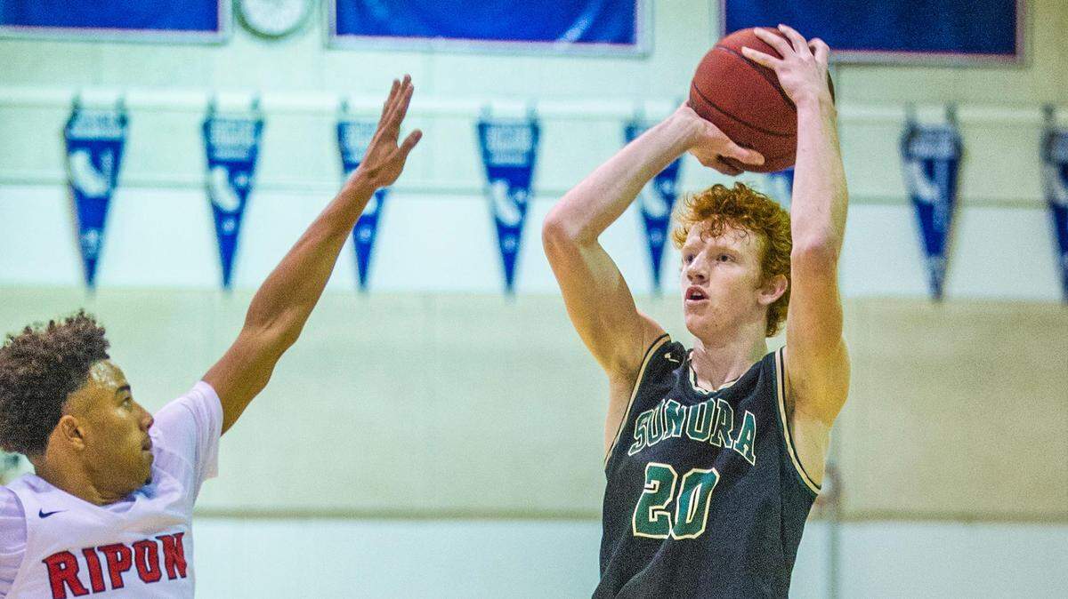 Austin Patterson, (20) of Sonora, elevates for a three-pointer, during the basketball matchup between Sonora High, and Ripon High, at the Modesto Christian Holiday Hoop Classic tournament, on Saturday, Dec. 28, 2019, in Modesto, California.