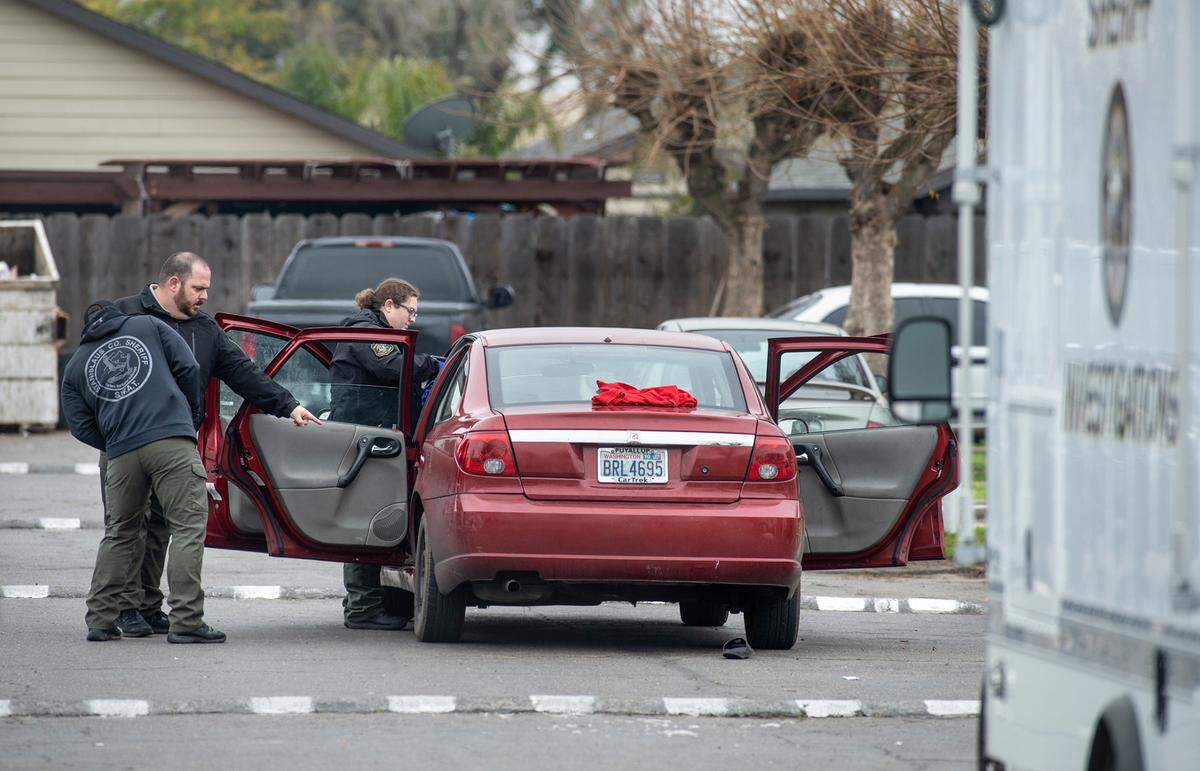 Stanislaus County Sheriff deputies investigate an assault on Adkinson Way in Modesto, Calif., on Monday, Dec. 20, 2021.